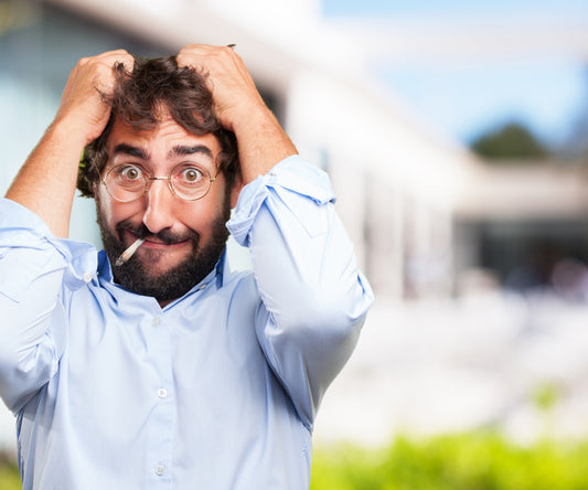 Worried Man pulling at hair